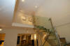 Stepping up ... Looking up past the stainless and glass staircase to the landing with original Britto drawings